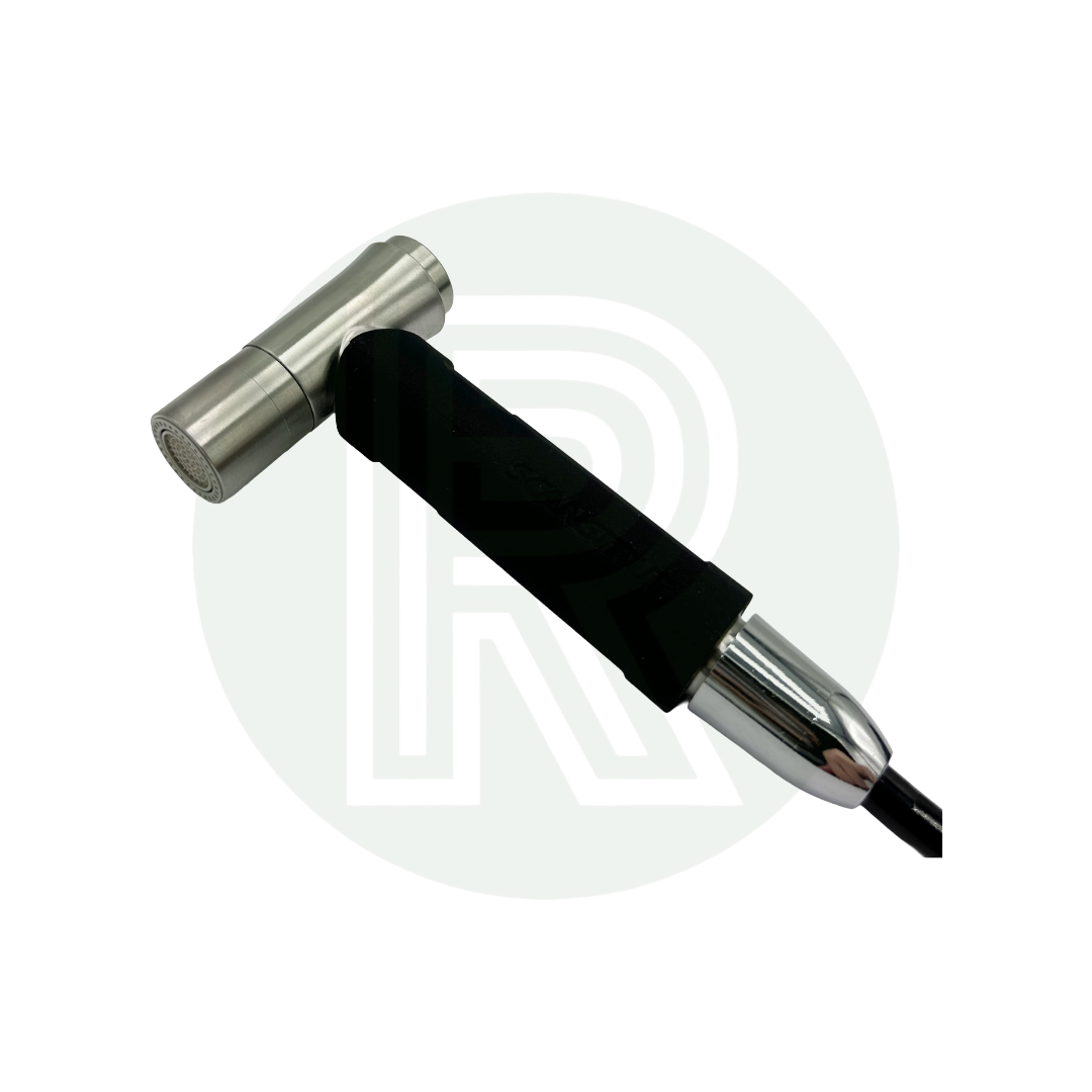 Close-up of spray nozzle and hose connector with metal fitting.
