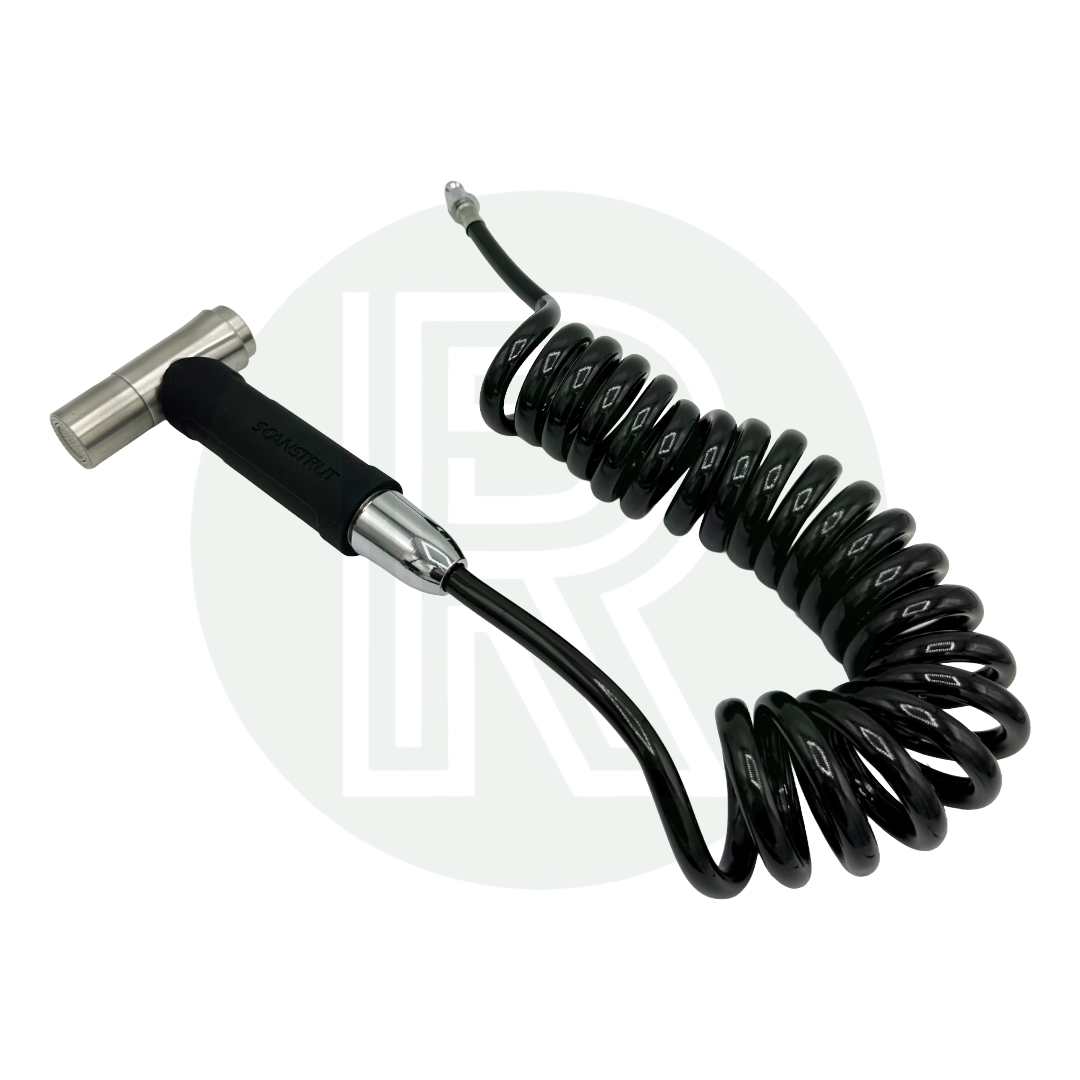 Coiled hose with connector and spray nozzle laid out for use.