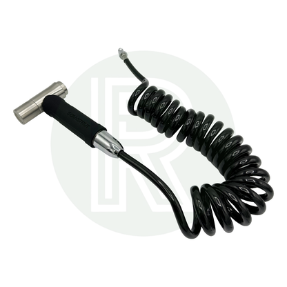 Coiled hose with connector and spray nozzle laid out for use.