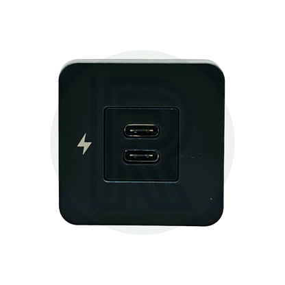 Front view of dual USB-C charging socket with two USB-C ports and lightning symbol on black panel.