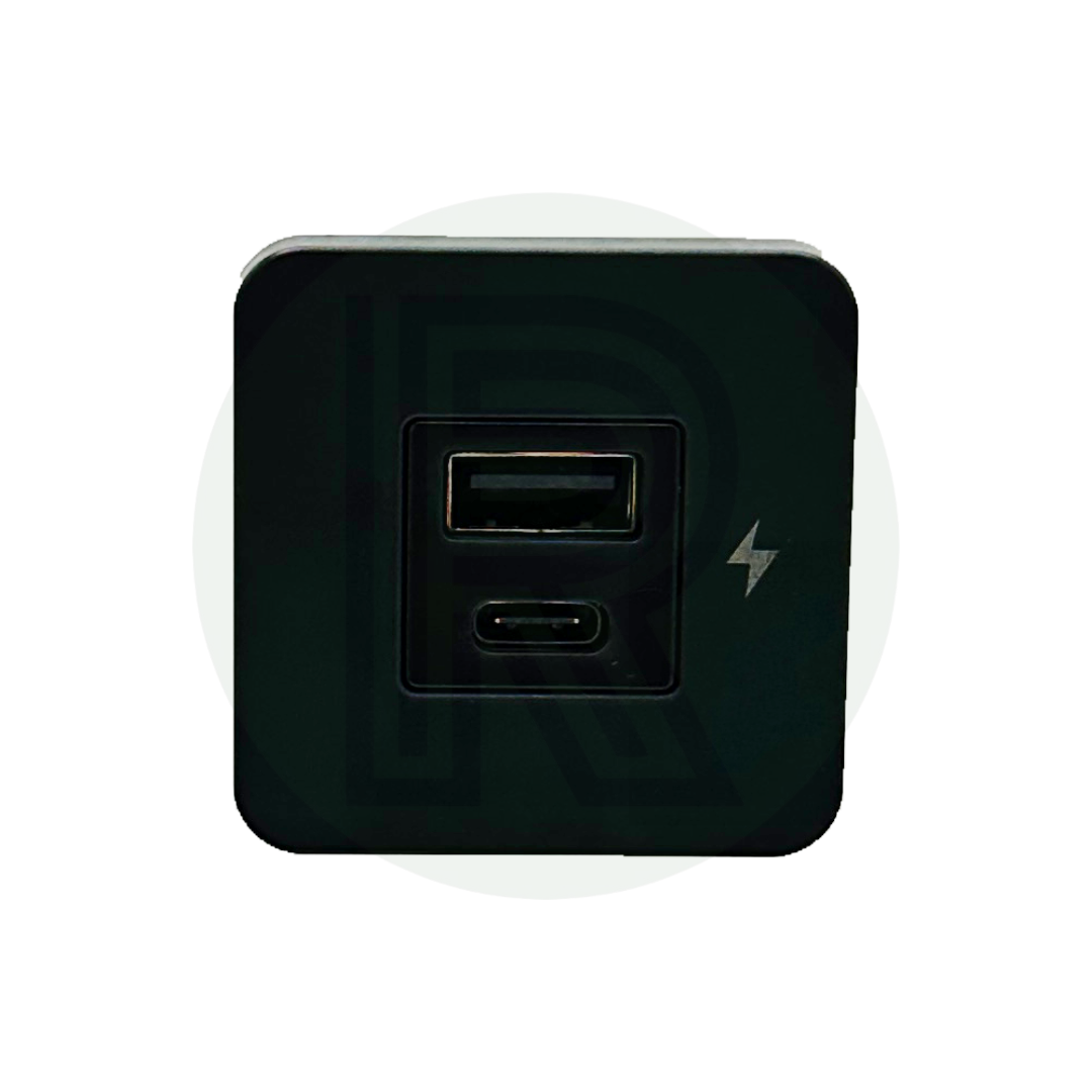 Front view of charging socket with one USB-A port, one USB-C port, and lightning symbol on black panel.