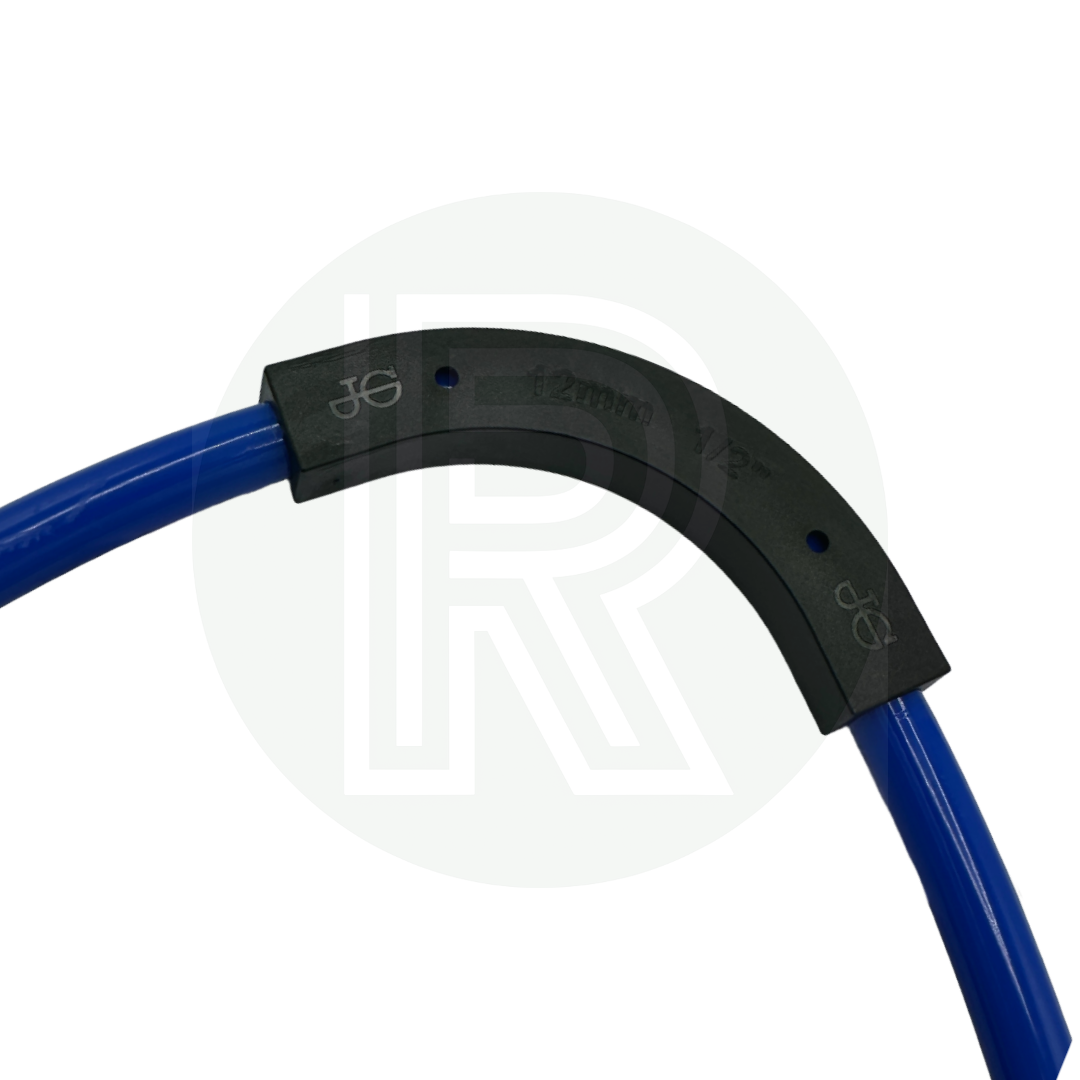 Top view of John Guest Speedfit 12mm flow bend installed on blue water pipe